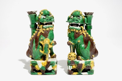 A pair of Chinese verte biscuit joss stick holders shaped as Buddhist lions, Kangxi