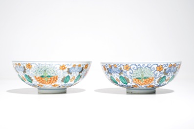 A pair of Chinese doucai bowls with floral famille rose medallions, 4-character mark, 19/20th C.