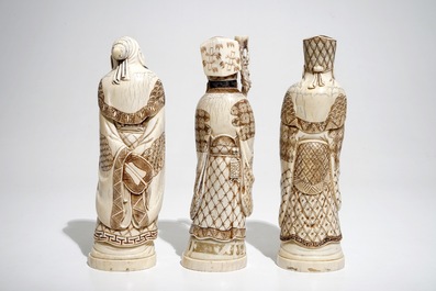 Three signed Japanese ivory okimono of bearded sages, Meiji, early 20th C.