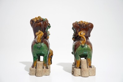 A pair of Chinese verte biscuit models of Buddhist lions, Kangxi