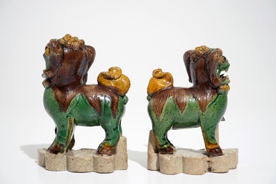 A pair of Chinese verte biscuit models of Buddhist lions, Kangxi