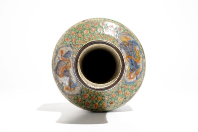 A Chinese famille verte crackle ware bottle vase, 19th C.