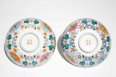 A pair of Chinese doucai bowls with floral famille rose medallions, 4-character mark, 19/20th C.