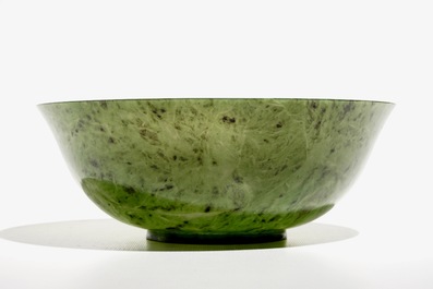 A Chinese thin-walled spinach green jade bowl, 20th C.