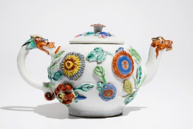 A Chinese famille rose teapot on stand with applied decoration, Yonzheng