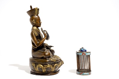 A Chinese bronze model of a seated Buddha and a cloisonn&eacute; cricket case, 19/20th C.