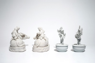 A pair of Chinese Dehua blanc de Chine prunus trees, Kangxi, and a pair of water buffalos with children, 20th C.