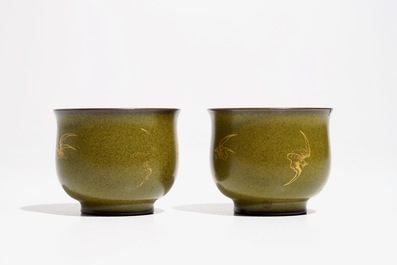 A pair of Chinese teadust-glazed and gilt wine cups with bats, Qianlong mark, 20th C.