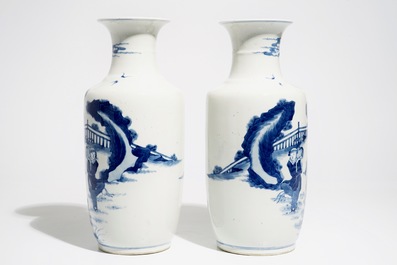 A pair of Chinese blue and white rouleau vases, Kangxi mark, 19/20th C.
