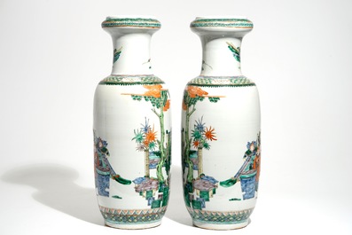 A pair of tall Chinese famille verte vases with court scenes, 19th C.