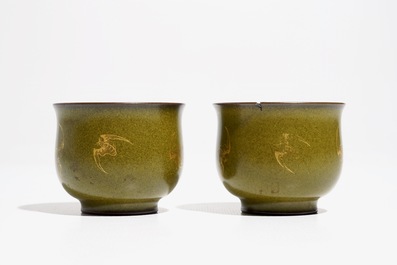 A pair of Chinese teadust-glazed and gilt wine cups with bats, Qianlong mark, 20th C.