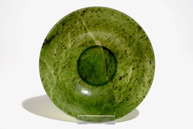 A Chinese thin-walled spinach green jade bowl, 20th C.