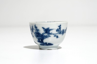 A set of five Chinese blue and white cups and saucers with birds among flowers, Kangxi