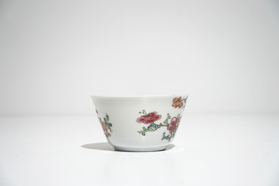 Five Chinese famille rose cups and saucers with vases among flowers, Yongzheng/Qianlong