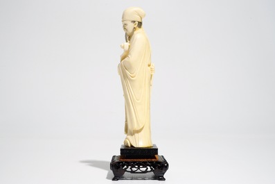 A Chinese ivory figure of a scholar, 19th C.