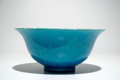 A Chinese monochrome turquoise bowl with incised design of horses, Kangxi mark, 19/20th C.