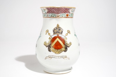 A large Chinese famille rose armorial jug with floral design, Yongzheng