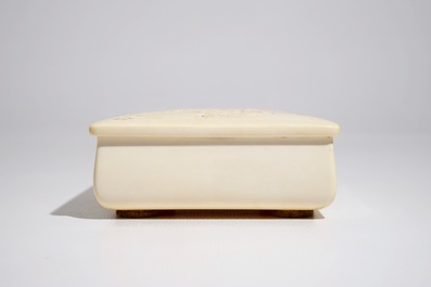 A signed Japanese rectangular carved ivory box and cover, Meiji, 19th C.