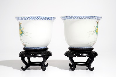 A pair of small Chinese famille rose jardinieres on wooden stands, early 20th C.