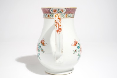 A large Chinese famille rose armorial jug with floral design, Yongzheng