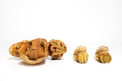 A Chinese ivory model of Guanyin on a Buddhist lion and two sages, 19th C.