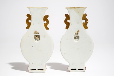 A pair of Chinese famille rose wall vases with figural design, 19th C.