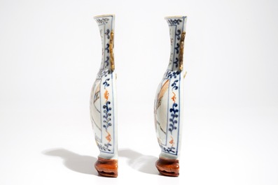 A pair of Chinese famille rose wall vases with figural design, 19th C.