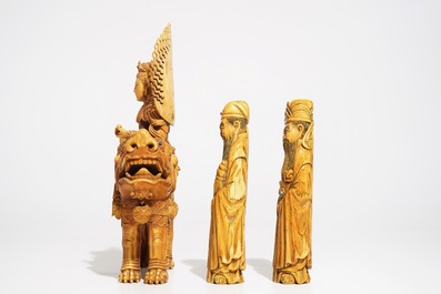 A Chinese ivory model of Guanyin on a Buddhist lion and two sages, 19th C.