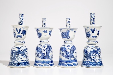 Two pairs of Chinese blue and white candlesticks with dragons, 19/20th C.