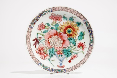 A fine Chinese famille rose cup and saucer with a flowervase, Yongzheng