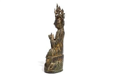 A Chinese inscribed and dated gilt bronze figure of Guanyin, Ming