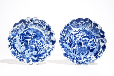 A pair of Chinese blue and white cups and saucers with qilin, yu mark, Kangxi