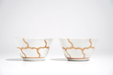 A pair of Chinese cups and saucers with gilt design, Yongzheng/Qianlong