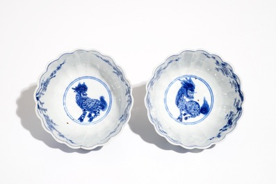 A pair of Chinese blue and white cups and saucers with qilin, yu mark, Kangxi