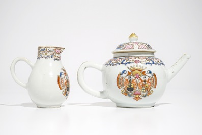 A Chinese famille rose armorial teapot and milk jug, Qianlong