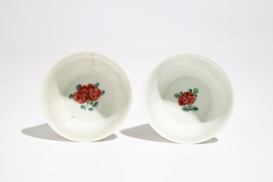 Two Chinese famille rose cups and three saucers with floral design, Yongzheng/Qianlong