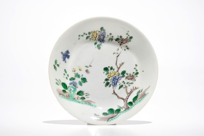 A Chinese famille verte cup and saucer with yin-yang mark, Kangxi