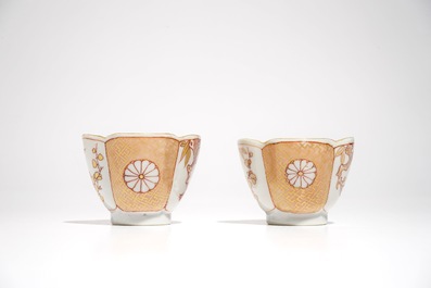 A pair of Chinese milk and blood quatrefoil cups and saucers, Kangxi