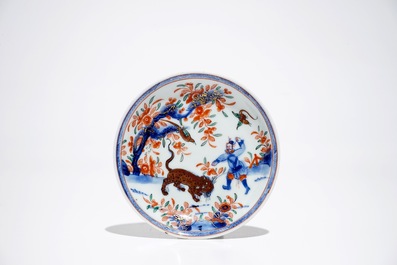 A Chinese Dutch-decorated Amsterdams bont cup and saucer with a tiger, Kangxi/Qianlong