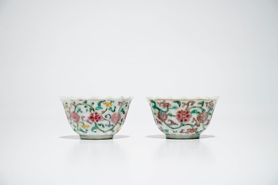 A pair of Chinese lobed famille rose cups and saucers, Yongzheng