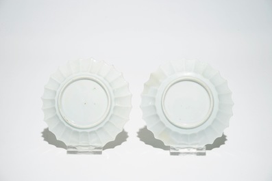 A pair of Chinese lobed famille rose cups and saucers, Yongzheng