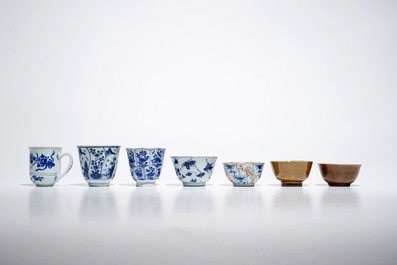 Seven Chinese blue and white, Imari style and famille rose cups and four saucers, Kangxi/Qianlong