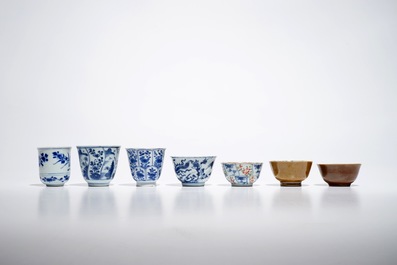 Seven Chinese blue and white, Imari style and famille rose cups and four saucers, Kangxi/Qianlong