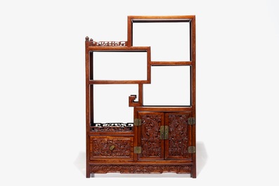 A small Chinese carved wood display with dragon panels, ca. 1900