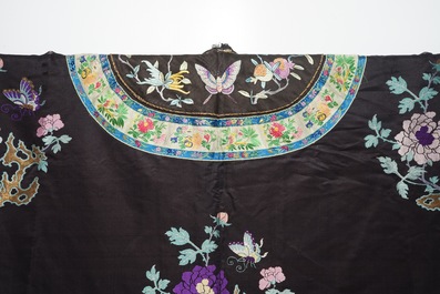 A Chinese embroidered silk woman's robe with butterflies and fruits, Qing