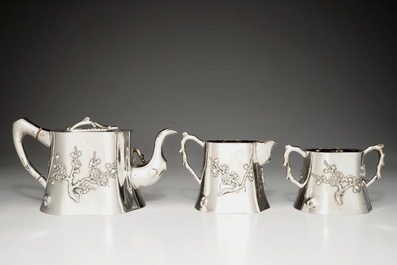 A Chinese silver teapot, milk jug and sugar bowl, Luen Wo, 1880-1940