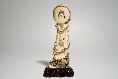 A Japanese ivory model of Guanyin on a carp, Taisho, ca. 1930, signed