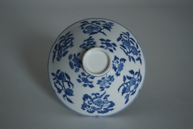 A Chinese blue and white bowl with flowers and fruits, 19th C.