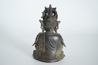 A Chinese bronze model of the seated Guanyin, Ming