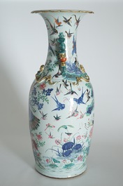 A very large Chinese famille rose vase with a peacock, 19th C.